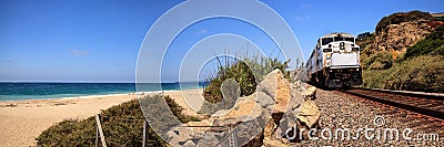 Train moves along tracks that run through San Clemente State Beach Editorial Stock Photo